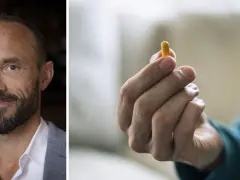 Man med skägg och en gul kapsel i handen. Kanske en illustration till vad betyder psykos.