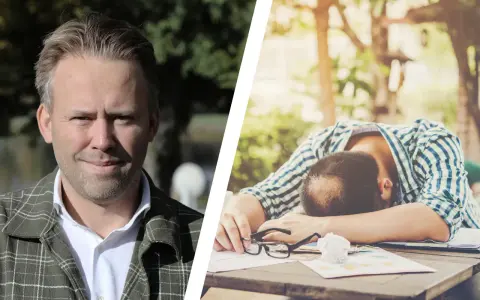 En man tittar framåt, medan en annan man ligger utslagen över ett bord, en bild som kan symbolisera vår depression.