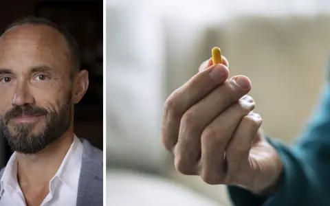Man med skägg och en gul kapsel i handen. Kanske en illustration till vad betyder psykos.