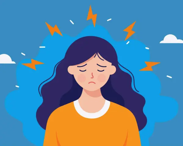 En person med mörkt hår och en orange tröja känner inre stress symptom, symboliserat av blixtar runt huvudet.