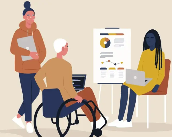 Tre personer vid ett möte. En i rullstol, en med laptop och en med en annan laptop. Känslan av psykisk misshandel på jobbet kan uppstå i sådana situationer.