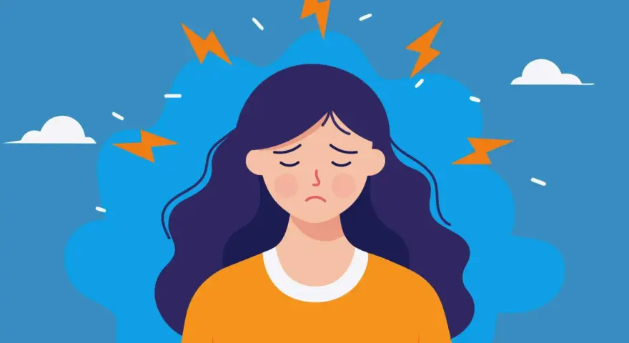 En person med mörkt hår och en orange tröja känner inre stress symptom, symboliserat av blixtar runt huvudet.