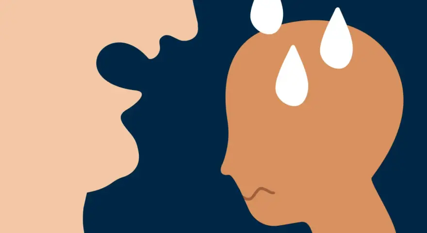 En person med svettpärlor på pannan och en orolig min möter en annan persons uttryckslösa ansikte. Omedveten psykisk misshandel kan lämna djupa spår.